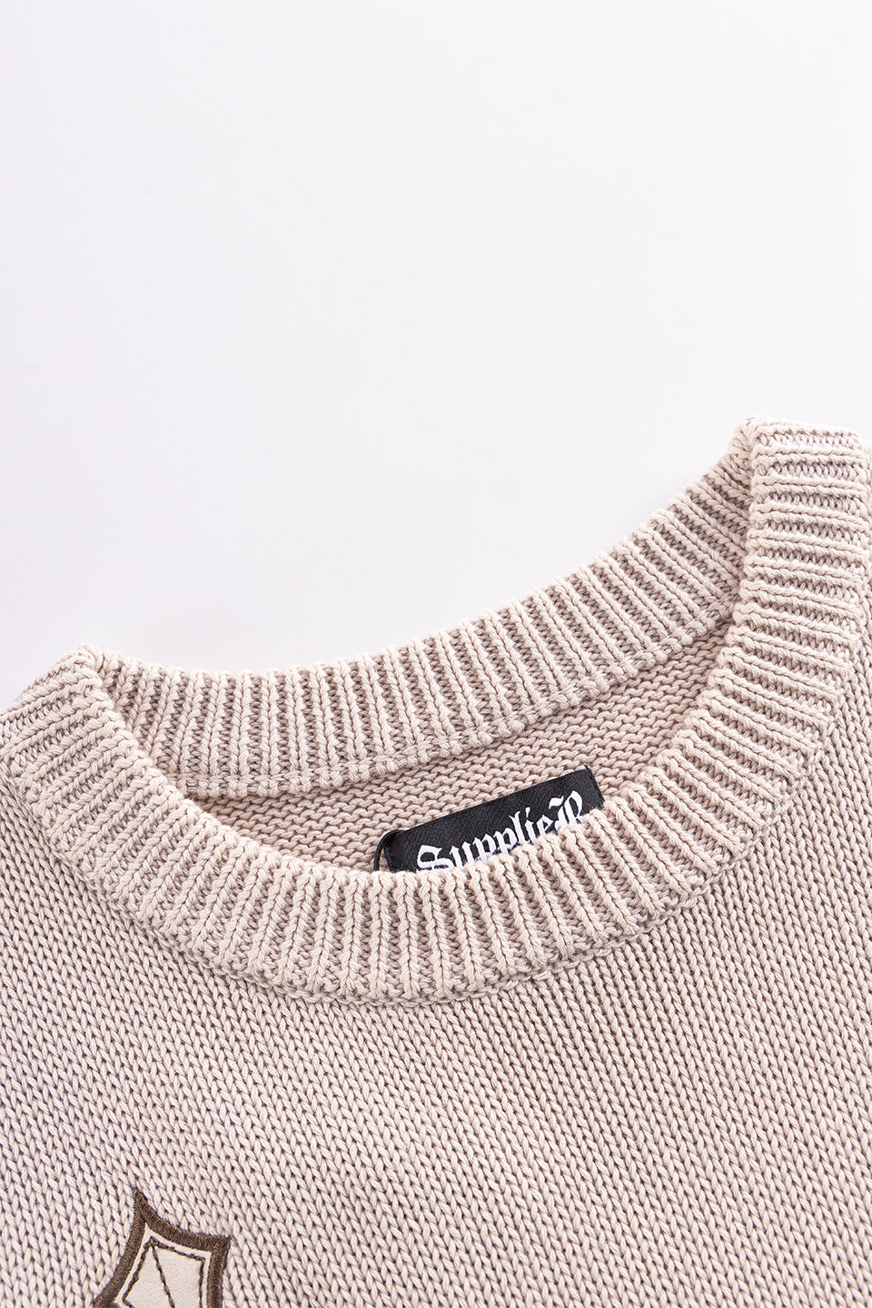 Distressed Multiple Cross Leather Patch Crew Knit