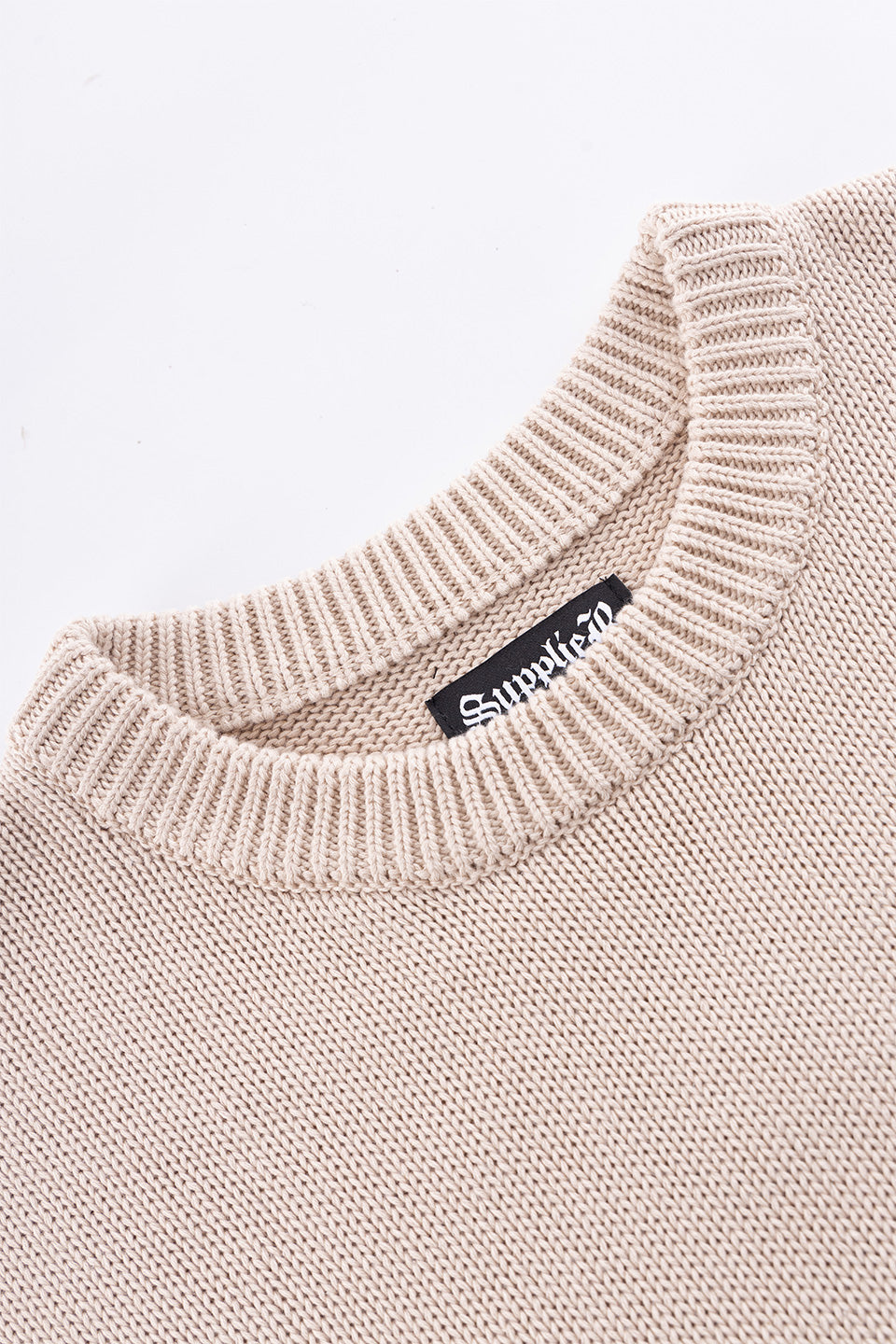 Tribal Cross Leather Patch Crew Knit